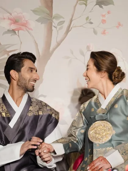A beautiful moment from an Indian-Korean fusion wedding, where the couple partakes in the traditional Paebaek ceremony. My expertise lies in respectfully and beautifully blending different cultures and traditions.