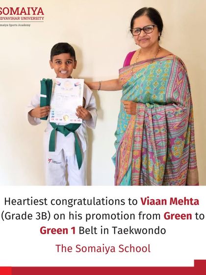 Viaan Mehta of The Somaiya School receives his Green 1 Belt in Taekwondo from the school principal.