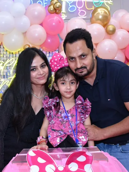 A beautiful family photo from a Minnie Mouse-themed birthday party. The joy of celebrating together is the most important part of any event, and I'm honored to help create these moments.