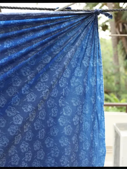 A breezy patchwork dress made for Christy Dawn. Each panel was custom block printed and hand-dyed in natural indigo and butterfly pea flowers, using a 14-step discharge print technique with all-natural plant resins.