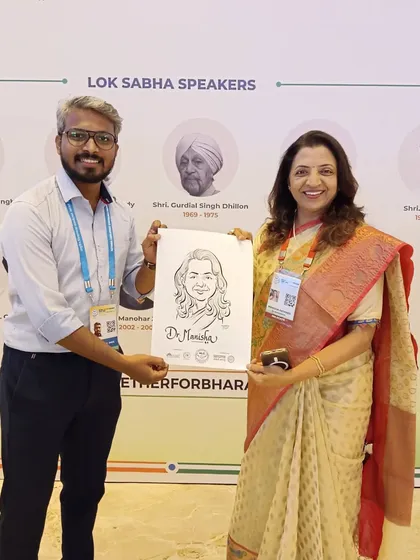 Presenting a caricature to Dr. Manisha Kayande at the NLC. It was a wonderful experience meeting and drawing legislators from across the country.