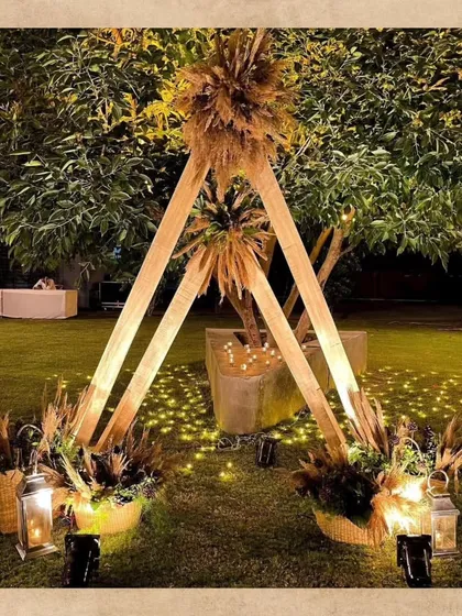 A unique teepee-style photobooth for a boho-themed event. I used wooden beams, pampas grass, and warm lanterns to create a rustic and dreamy corner for guests to capture memories.