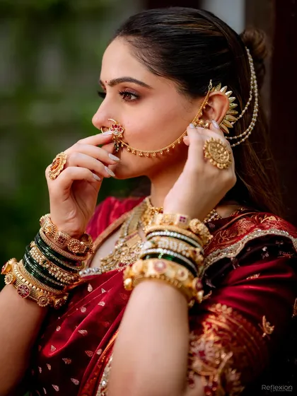 A detailed shot of the traditional Maharashtrian jewelry. I always ensure the makeup works in harmony with the accessories, like this stunning nath and ear chain.
