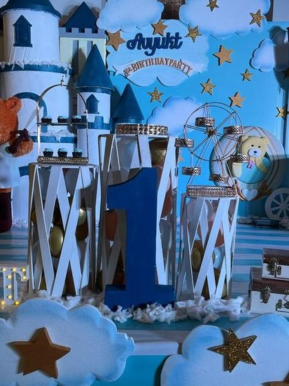 A close up of the charming castle theme, showing the teddy bear prince, a toy horse, and a mini Ferris wheel prop.