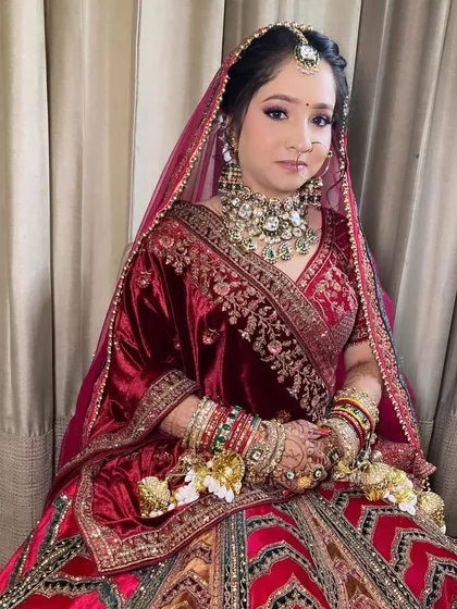 My bride Komal, looking absolutely radiant. I used soft purple and pink tones on her eyes to complement her beautiful velvet lehenga.