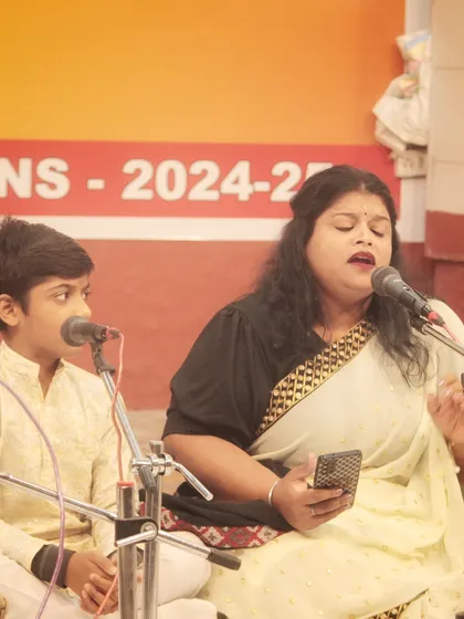 A young boy and his mother performing a duet. Music is often a journey that families can share and enjoy together.