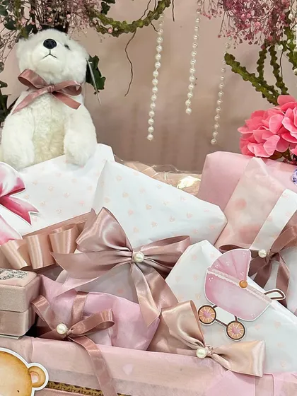 This pink hamper is all about soft textures and elegant details. Each gift is wrapped with satin ribbons and pearl accents, creating a truly luxurious feel.