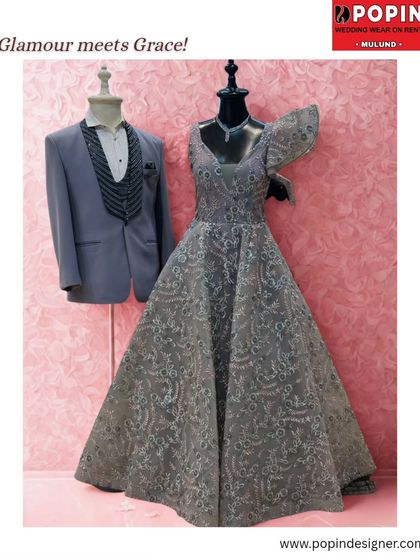 "Glamour meets Grace". This image showcases the grey ball gown on a mannequin, highlighting its intricate lacework and full, princess-like skirt.