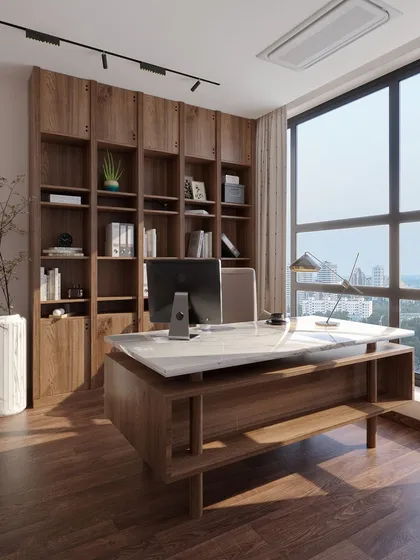 This home office is designed for focus and clarity, with a large window providing ample natural light and a city view. The custom desk with a marble top and the floor-to-ceiling wooden bookcase offer both style and extensive storage.