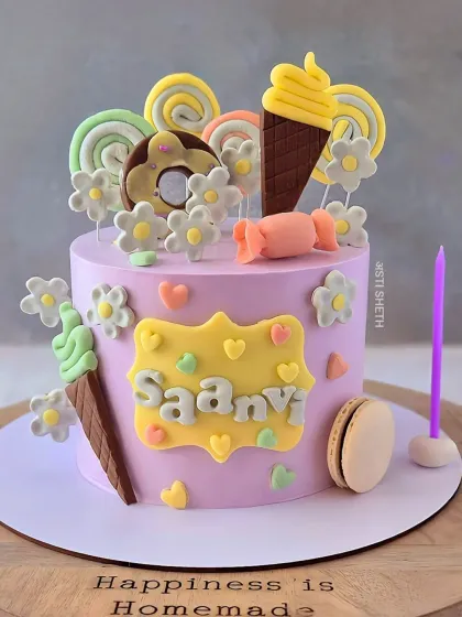 A sweet and playful candy and ice cream themed cake in a lovely lavender shade. This Chocolate Mousse cake is perfect for a little one's celebration.