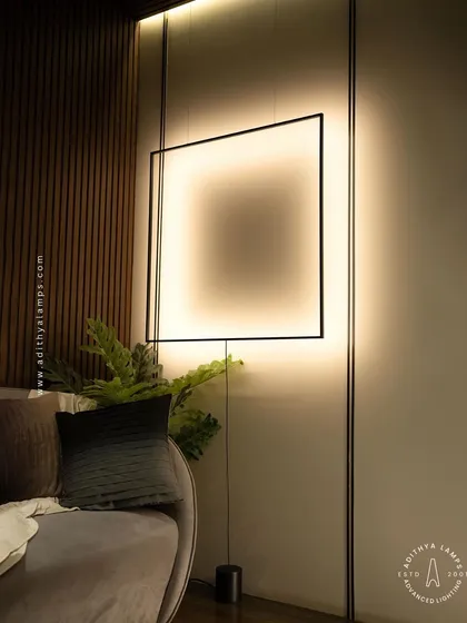 A duplicate of image 99, this image shows the suspended frame light from a slightly different angle, emphasizing its role as a room-defining art piece.