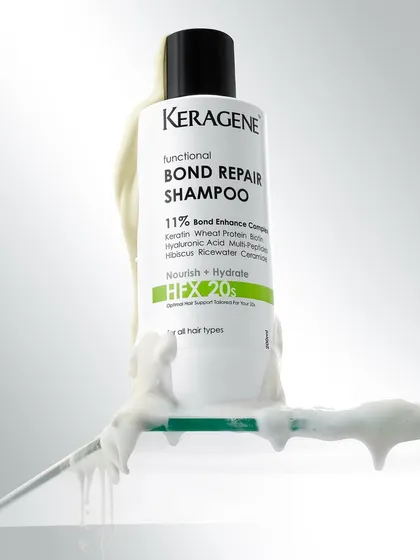A shampoo bottle with a thick, foamy lather texture. This shot focuses on the user experience, showing the rich quality of the product that customers can expect.