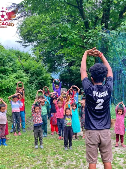 We start every session with energy and focus. Here, we are leading a morning warm-up and stretching session with the children of Grahan village, getting them ready for a day of learning football fundamentals in the beautiful Parvati Valley.