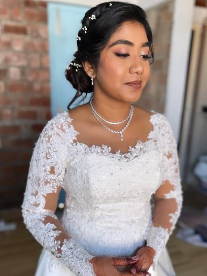 My beautiful bride Anu for her church wedding. We did a soft glam look with warm, peachy-pink eyes and a natural lip.