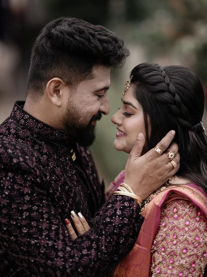 A close up portrait of the couple. The groom's gentle touch and their shared look make this a very tender and romantic shot.