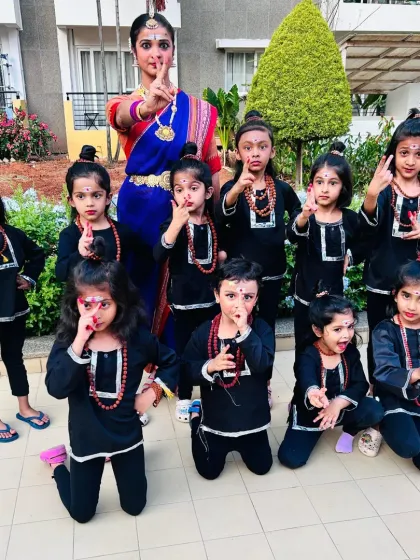 This picture fills my heart with so much joy! Here I am with my wonderful little students, all dressed up as little Shivas for a Shivratri performance. Seeing their happy faces is why I love teaching kids' dance classes.