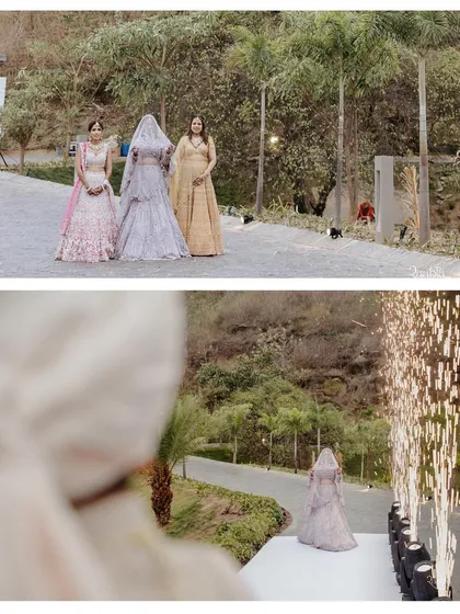 The bride's grand entrance, with her bridesmaids watching from above and cold pyros lining her path. The groom's perspective shot captures the anticipation and magic of her approach.