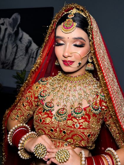A serene shot of a bride with her eyes closed, showcasing the beautiful blend of her eyeshadow and the flawless finish of her makeup.