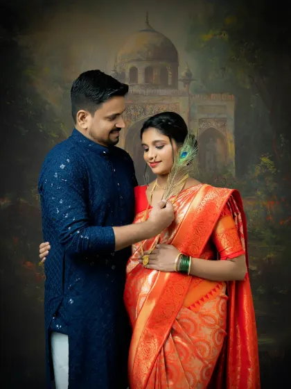 A gentle moment between an expecting couple. The peacock feather is a beautiful cultural symbol, adding a touch of grace and divinity to this traditional maternity portrait.