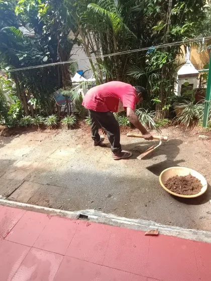 The preparation phase for an artificial grass installation. My team is clearing and preparing the ground to ensure a smooth, level base.