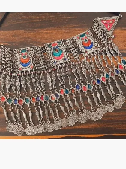 A colorful oxidised silver choker set with enamel work and coin details, perfect for a Navratri look.