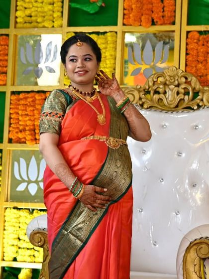Another pose from the baby shower. The makeup is kept traditional with a focus on her eyes and a lip color that complements her saree.