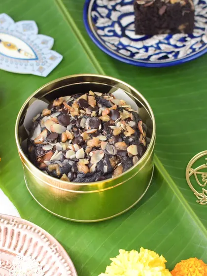 My Ragi Chocolate Walnut Cake packed in its golden tin, ready for gifting.