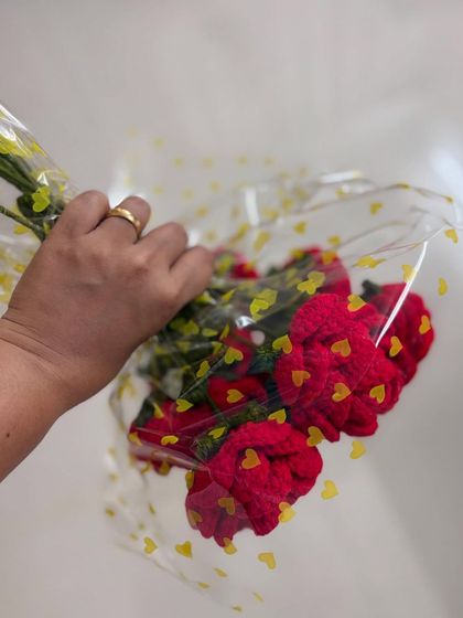 This shot shows how I package my red rose bouquets, wrapped in heart-printed cellophane to make your gift extra special.