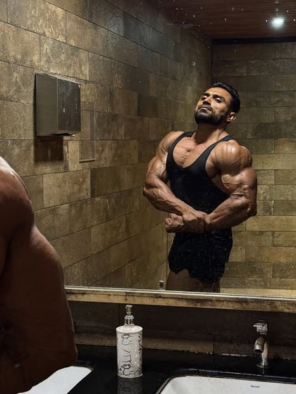 It's not full dry condition, but the work is showing. Posing in the mirror to check progress.