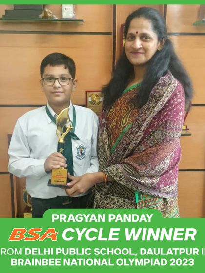 Pragyan Panday proudly holds his trophy after winning the BSA Cycle in our 2023 National Olympiad.