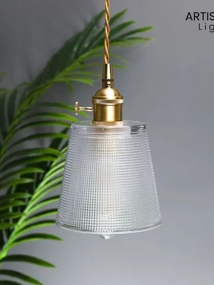 This simple yet beautiful pendant features a textured glass shade and vintage-style brass fitting. The warm glow it produces is like a hug for your soul, making it the perfect hanging light for a cozy reading nook or beside your bed.