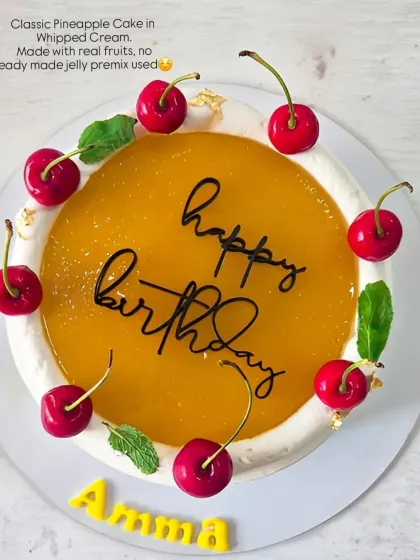My classic Pineapple cake, made with real fruit and no premixes. It's topped with a homemade pineapple compote and fresh cherries.