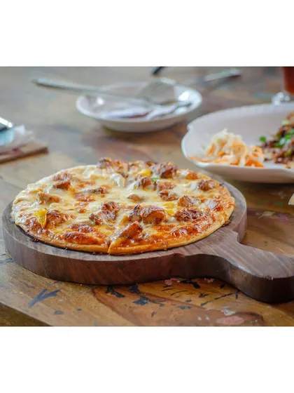 I believe in making food that brings joy, like this perfectly baked pizza with generous toppings and melted cheese. It's a favorite among our regulars and a great dish to share with friends while you get creative.