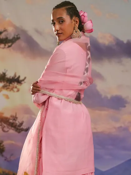 The back of this pink kurta from the Gulnaar collection features a beautiful and unique design, showcasing the thoughtful craftsmanship.