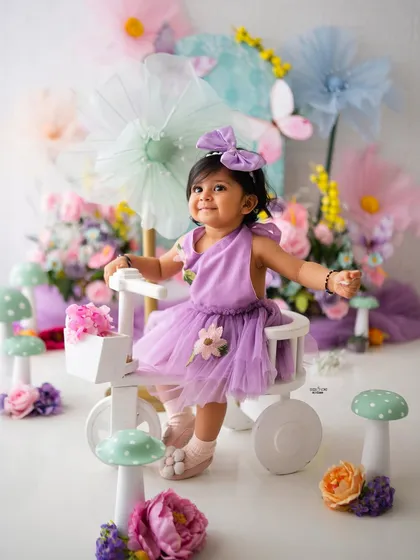 Her arms wide open, ready for a hug! This happy shot captures the pure joy of a toddler photoshoot.