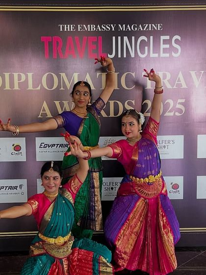 Three of my students striking a classic Bharatanatyam pose. Their expressions and postures reflect the storytelling and grace inherent in the dance.