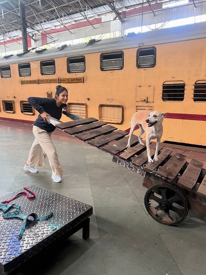 Having some fun at the train station before our trip.