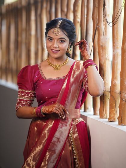 Another angle of the modern half-saree look. The makeup is simple and elegant, with a focus on clean lines and a natural finish.