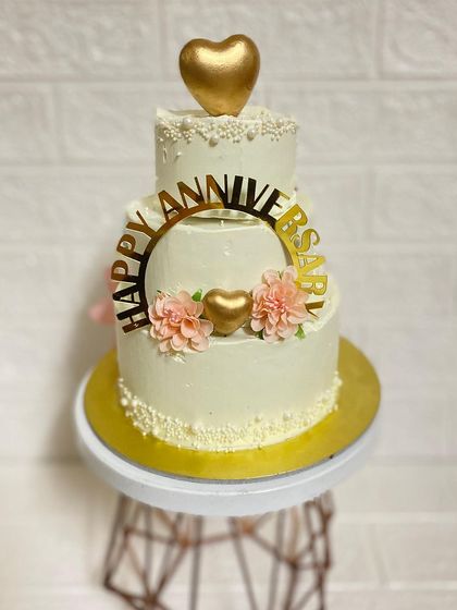 The mini three-tier chocolate truffle cake we made for an anniversary. It's small in size but big on elegance.