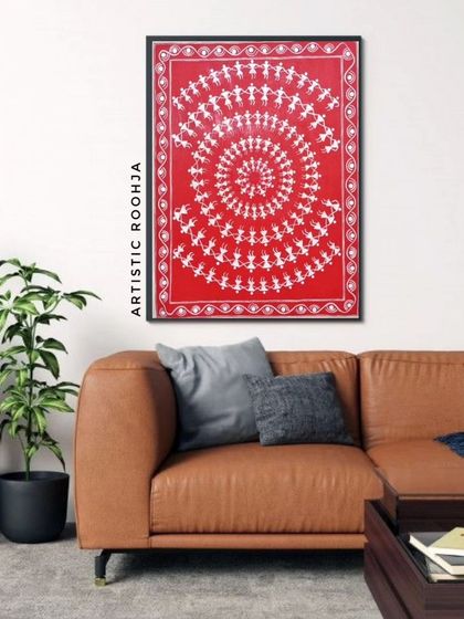 Another home decor mockup showing how a framed Warli painting can bring a touch of traditional elegance to a modern living room with a leather sofa.