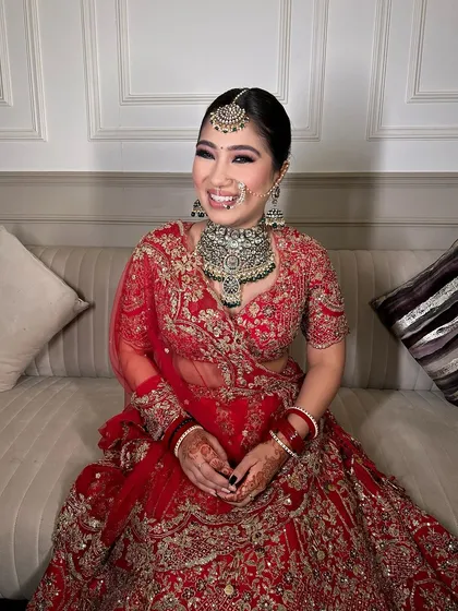 A full, happy smile from a bride who feels confident and beautiful on her special day.