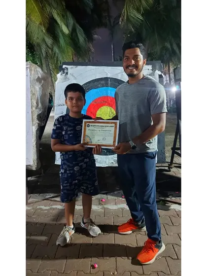 One of our youngest summer camp graduates. He was thrilled to receive his certificate after a fun-filled final day of balloon-popping matches.