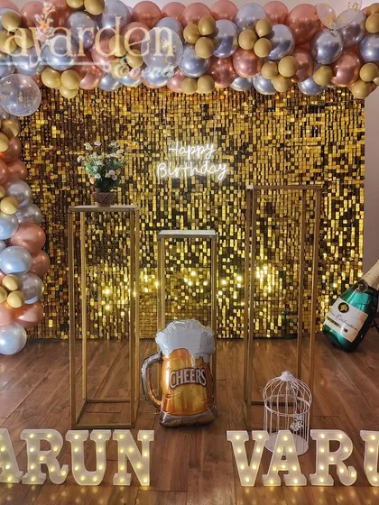 A fun and festive party setup with a gold sequin wall, a 'Happy Birthday' neon sign, and marquee letters. The beer and champagne foil balloons show how I can customize the decor to your taste.