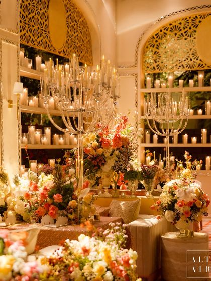 A stunning display of florals and candelabras at the 'Sitara Mahal' dinner. The abundance of flowers and candlelight created a rich, luxurious, and deeply romantic atmosphere.
