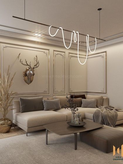 A neo-classical living room with contemporary touches, featuring elegant wall beading, a modern sculptural light fixture, and a muted, tranquil color palette.