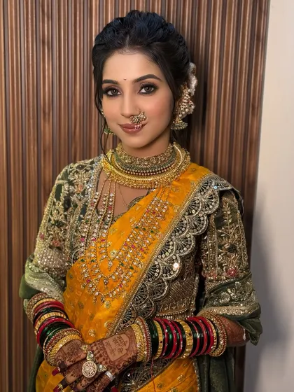 Embracing our beautiful Maharashtrian traditions. For this bride, I created an authentic look featuring a bold, expressive eye, a classic bridal nose ring (nath), and a neat bun adorned with flowers. This look is a celebration of culture, designed to make any bride feel like royalty on her special day.