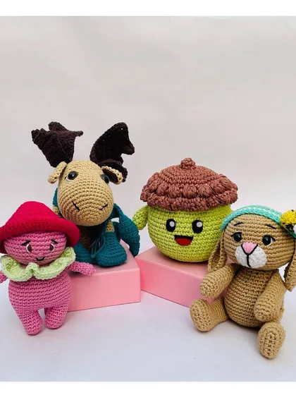 Here is my little woodland gang all together. This collection features a mushroom sprite, a moose, a happy acorn, and a bunny, showing the variety of cute characters I can make.