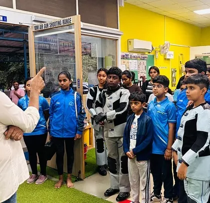 My role as a coach goes beyond technique; it's about building confidence and a winning mindset. Here, I am briefing our young shooters before a training session at our Hulimavu academy.