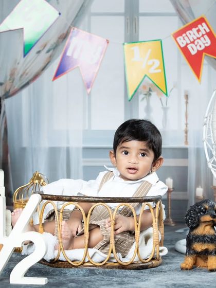 This little one is looking curious during his half-birthday photoshoot.