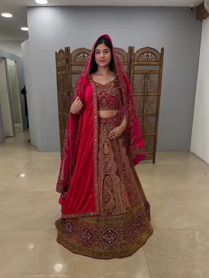 A full view of the luxurious velvet bridal lehenga, showing its beautiful flare and detailed craftsmanship.